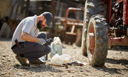 Man working on tractor